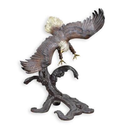 A BRONZE SCULPTURE OF A EAGLE IN FLIGHT