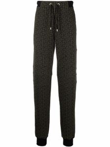 Balmain pantalon de jogging à imprimé monogrammé - Marron