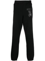 Moschino pantalon de jogging en coton biologique à logo imprimé - Noir - thumbnail