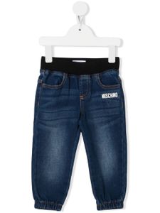 Moschino Kids pantalon en jean à logo imprimé - Bleu