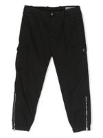 Brunello Cucinelli Kids pantalon fuselé en coton - Noir