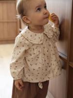 Bedrukte babyblouse in fluweel / velours vanille