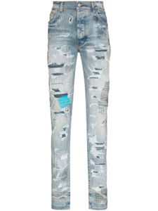 AMIRI jean skinny à fini usé - Bleu