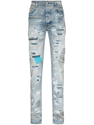 AMIRI jean skinny à fini usé - Bleu
