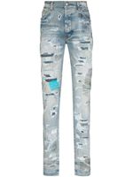 AMIRI jean skinny à fini usé - Bleu