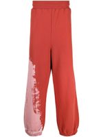 A-COLD-WALL* pantalon de jogging à motif tie-dye - Rouge