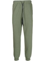 AAPE BY *A BATHING APE® pantalon de jogging à patch logo - Vert