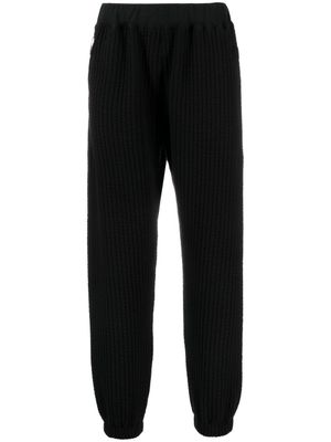 White Mountaineering pantalon de jogging à design nervuré - Noir
