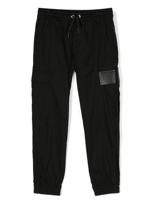 Givenchy Kids pantalon de jogging à patch logo - Noir