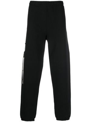 Heron Preston pantalon de jogging à logo imprimé - Noir