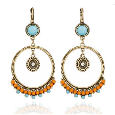 Etnische statement oorbellen van Deja Jewels - Oranje & Turquoise
