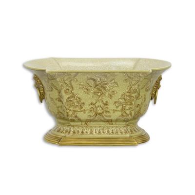 A BRONZE MOUNTED PORCELAIN PLANTER