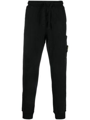 Stone Island pantalon de jogging à patch Compass - Noir