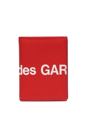 Comme Des Garçons portefeuille pliant à logo imprimé - Rouge