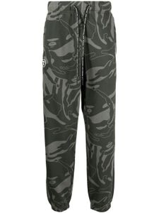 AAPE BY *A BATHING APE® pantalon fuselé à imprimé graphique - Vert