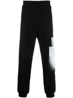 A-COLD-WALL* pantalon de jogging à logo Brutalist imprimé - Noir