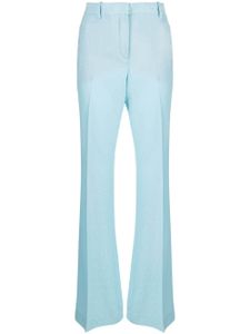 Versace pantalon évasé à logo imprimé - Bleu