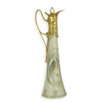 A BRONZE MOUNTED PORCELAIN CLARET JUG A BRONZE MOUNTED PORCELAIN CLARET JUG