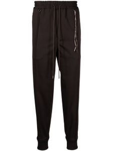 Mastermind World pantalon de jogging à logo jacquard - Marron