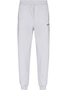 Helmut Lang pantalon de jogging fuselé à logo imprimé - Gris