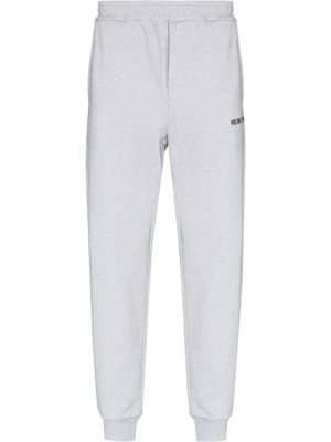 Helmut Lang pantalon de jogging fuselé à logo imprimé - Gris