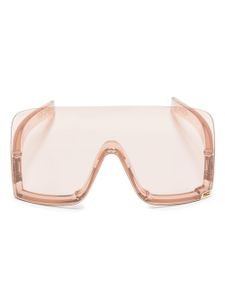 Gucci Eyewear lunettes de soleil couvrantes à logo gravé - Tons neutres