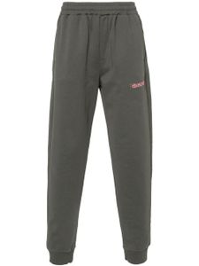 Helmut Lang pantalon de jogging à logo imprimé - Gris