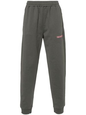 Helmut Lang pantalon de jogging à logo imprimé - Gris