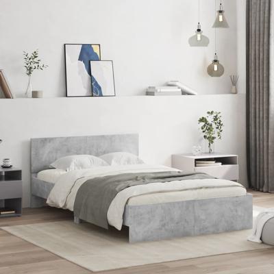 Bedframe met hoofdeinde betongrijs 135x190 cm