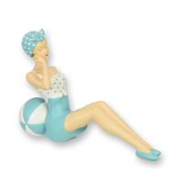 A RESIN FIGURINE OF A RETRO BEACH GIRL A RESIN FIGURINE OF A RETRO BEACH GIRL