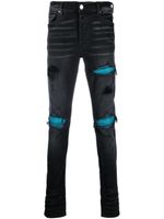 AMIRI jean skinny à effet usé - Noir