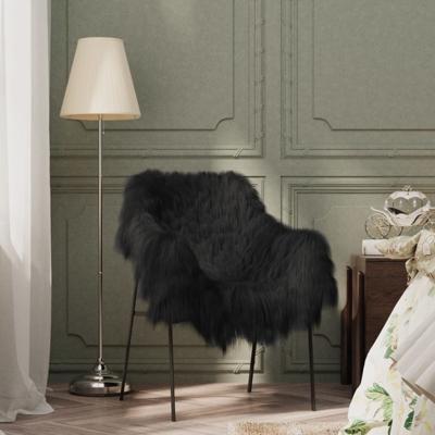 VidaXL Stoelhoes ijslander schapenleer 70x110 cm zwart
