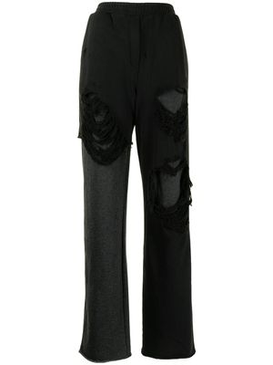 Goen.J pantalon ample à effet usé - Noir