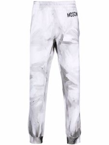 Moschino pantalon de jogging à logo imprimé - Blanc