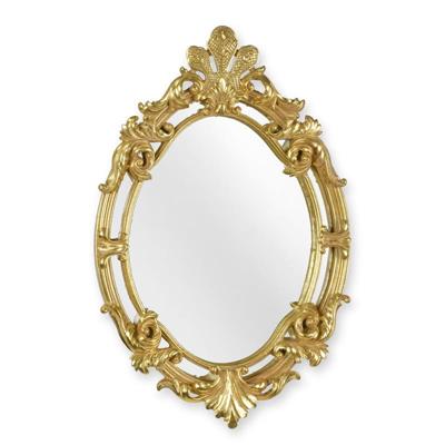 A RESIN FRAMED GOLD MIRROR