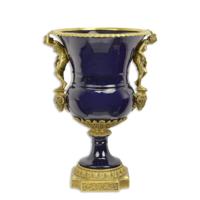 A BRONZE MOUNTED PORCELAIN URN