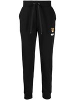 Moschino logo-patch track pants - Noir - thumbnail