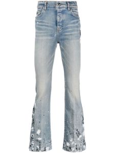 AMIRI jean à effet taches de peinture - Bleu