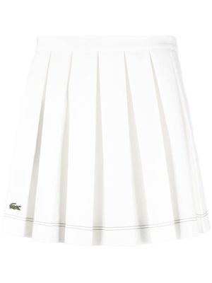 Lacoste x Roland Garros minijupe plissée à coupe évasée - Blanc