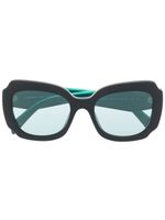 Prada Eyewear lunettes de soleil teintées à logo imprimé - Noir