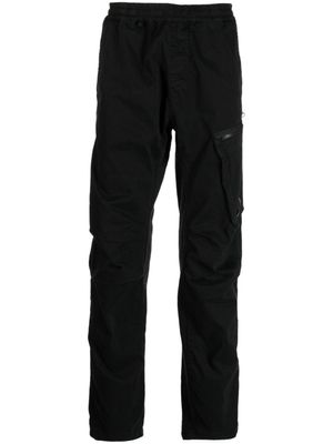 C.P. Company pantalon fuselé à patch logo - Noir