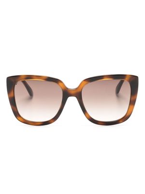 Moschino Eyewear lunettes de soleil à monture papillon - Marron