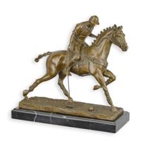 A BRONZE SCULPTURE OF A POLO PLAYER A BRONZE SCULPTURE OF A POLO PLAYER