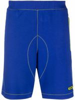 Moschino short de sport à logo imprimé - Violet