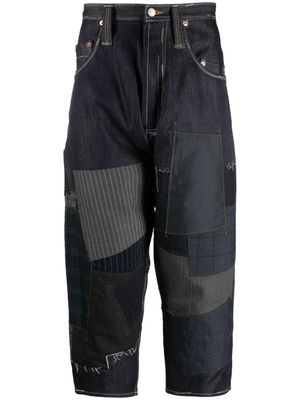 Junya Watanabe MAN pantalon à design patchwork - Bleu