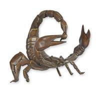 A BRONZE SCULPTURE OF A SCORPION