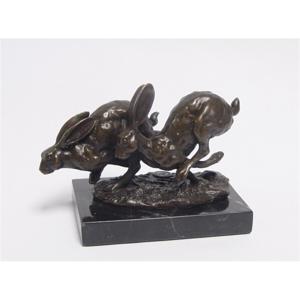 A BRONZE SCULPTURE OF TWO RUNNING HARES