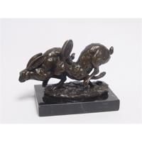 A BRONZE SCULPTURE OF TWO RUNNING HARES A BRONZE SCULPTURE OF TWO RUNNING HARES