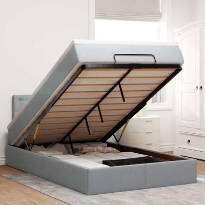 Ottoman bed met matras en LED's 120x200 cm stof lichtgrijs