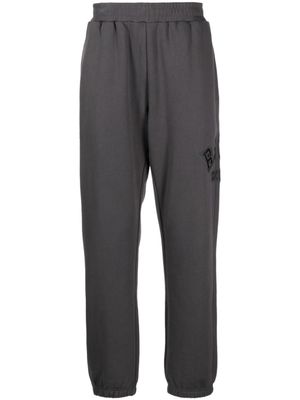 izzue pantalon de jogging à logo appliqué - Gris